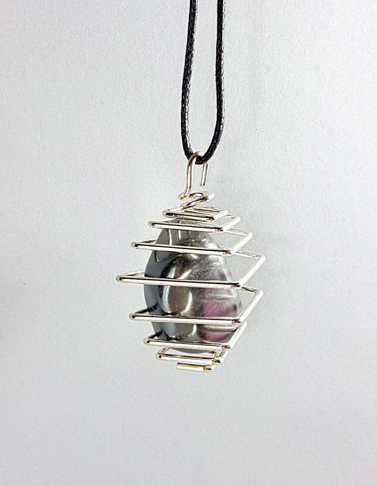 colgante hematite jaula